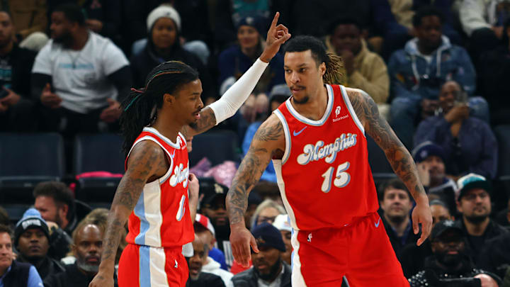 Jan 20, 2025; Memphis, Tennessee, USA; Memphis Grizzlies forward Brandon Clarke (15) reacts with guard Ja Morant (12) during the second quarter against the Minnesota Timberwolves at FedExForum. Mandatory Credit: Petre Thomas-Imagn Images