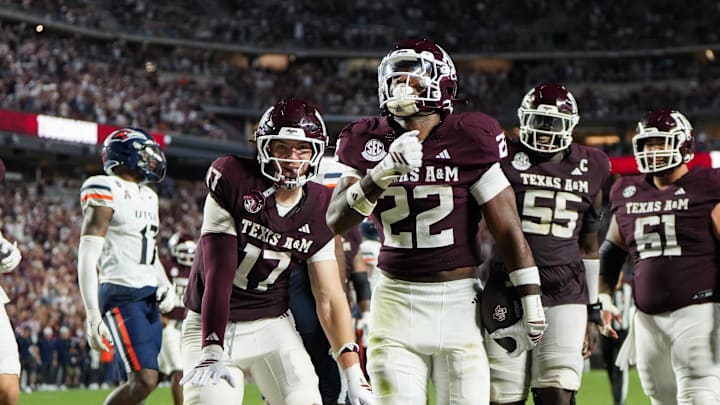 Aug 30, 2025; College Station, Texas, USA; Texas A&M Aggies tight end Theo Melin Ohrstrom (17) and Texas A&M Aggies running back EJ Smith (22) celebrate a touchdown during the second half against the UTSA Roadrunners at Kyle Field. Mandatory Credit: Sean Thomas-Imagn Images