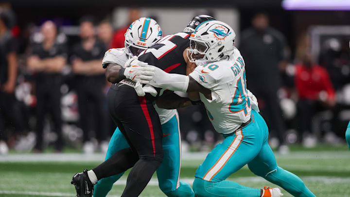 Miami Dolphins linebacker Willie Gay Jr. (40) tackles Atlanta Falcons running back Tyler Allgeier (25) in the fourth quarter at Mercedes-Benz Stadium. 