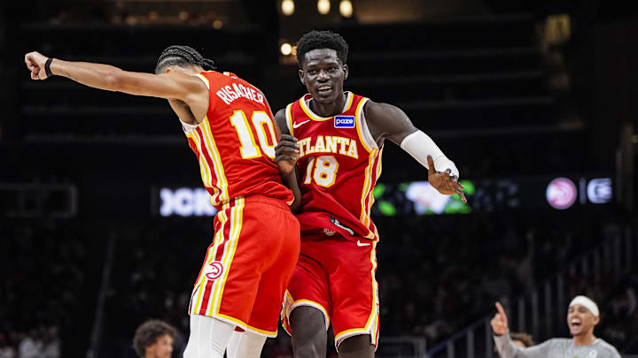Nov 8, 2025; Atlanta, Georgia, USA; Atlanta Hawks forward Zaccharie Risacher (10) and forward Mouhamed Gueye (18) react after a play against the Los Angeles Lakers during the second half at State Farm Arena. Mandatory Credit: Dale Zanine-Imagn Images