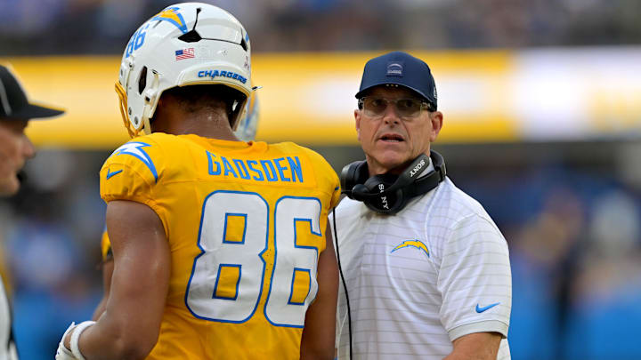 Oct 19, 2025; Inglewood, California, USA; Los Angeles Chargers head coach Jim Harbaugh congratulates tight end Oronde Gadsden II (86) after a touchdown in the first half against the Indianapolis Colts at SoFi Stadium. 