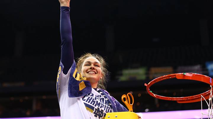 Apr 1, 2018; Columbus, OH, USA; Notre Dame Fighting Irish forward Kathryn Westbeld (33) holds up a piece of the net after defeating the Mississippi State Lady Bulldogs in the championship game of the women's Final Four in the 2018 NCAA Tournament at Nationwide Arena. Notre Dame won 61-58. Mandatory Credit: Aaron Doster-Imagn Images