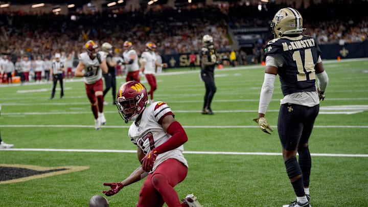 Dec 15, 2024; New Orleans, Louisiana, USA; Washington Commanders wide receiver Terry McLaurin (17) celebrates a touchdown against the New Orleans Saints cornerback Kool-Aid McKinstry (14) during the first half at Caesars Superdome. Mandatory Credit: Matthew Hinton-Imagn Images Dec 15, 2024; New Orleans, Louisiana, USA; Washington Commanders wide receiver Terry McLaurin (17) celebrates a touchdown against the New Orleans Saints cornerback Kool-Aid McKinstry (14) during the first half at Caesars Superdome. Mandatory Credit: Matthew Hinton-Imagn Images