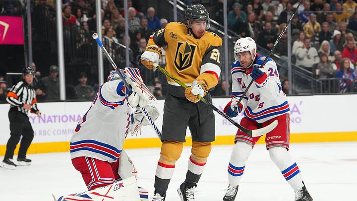 Nov 18, 2025; Las Vegas, Nevada, USA; A shot deflects off Vegas Golden Knights center Brett Howden (21) between New York Rangers goaltender Igor Shesterkin (31) and defenseman Carson Soucy (24) during the first period at T-Mobile Arena. Mandatory Credit: Stephen R. Sylvanie-Imagn Images Nov 18, 2025; Las Vegas, Nevada, USA; A shot deflects off Vegas Golden Knights center Brett Howden (21) between New York Rangers goaltender Igor Shesterkin (31) and defenseman Carson Soucy (24) during the first period at T-Mobile Arena. Mandatory Credit: Stephen R. Sylvanie-Imagn Images
