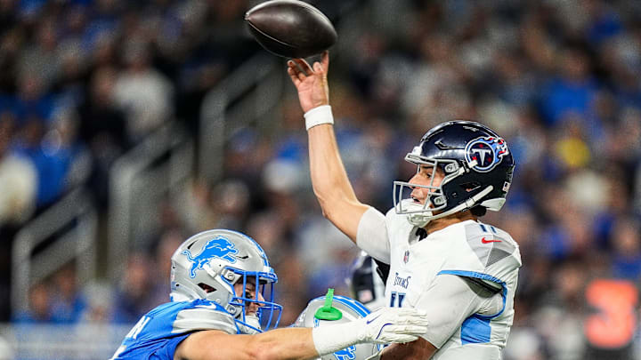 Tennessee Titans quarterback Mason Rudolph (11) makes a pass against Detroit Lions linebacker Ben Niemann (51) and safety Brian Branch (32) during the second half at Ford Field in Detroit on Sunday, Oct. 27, 2024.