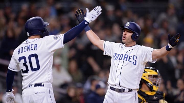 May 16, 2019; San Diego, CA, USA; San Diego Padres second baseman Ian Kinsler (right) is congratulated by first baseman Eric Hosmer (30) after hitting a three-run home run during the sixth inning against the Pittsburgh Pirates at Petco Park. Mandatory Credit: Orlando Ramirez-Imagn Images