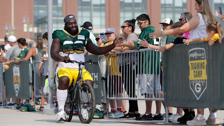 Green Bay Packers defensive lineman Nazir Stackhouse rides to practice at training camp. Green Bay Packers defensive lineman Nazir Stackhouse rides to practice at training camp.