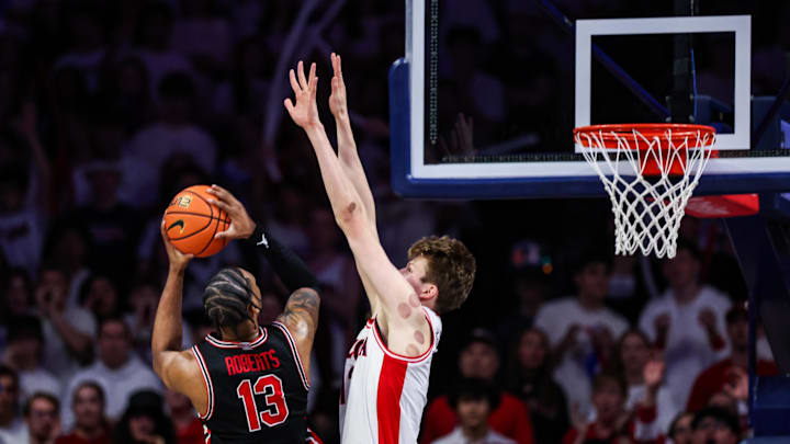 Feb 15, 2025; Tucson, Arizona, USA; Arizona Wildcats forward Henri Veesaar (13) attempts to block a shot made by Houston Cougars forward J’Wan Roberts (13) during the second half at McKale Center. Mandatory Credit: Aryanna Frank-Imagn Images