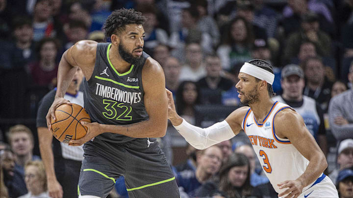 Nov 20, 2023; Minneapolis, Minnesota, USA; Minnesota Timberwolves center Karl-Anthony Towns (32) looks to pass the ball over New York Knicks guard Josh Hart (3) in the first half at Target Center. Mandatory Credit: Jesse Johnson-Imagn Images