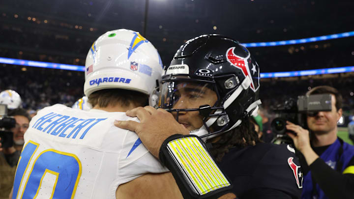 Jan 11, 2025; Houston, Texas, USA; Houston Texans quarterback C.J. Stroud (7) and Los Angeles Chargers quarterback Justin Herbert (10) after defeating the Los Angeles Chargers in an AFC wild card game at NRG Stadium. Mandatory Credit: Thomas Shea-Imagn Images Jan 11, 2025; Houston, Texas, USA; Houston Texans quarterback C.J. Stroud (7) and Los Angeles Chargers quarterback Justin Herbert (10) after defeating the Los Angeles Chargers in an AFC wild card game at NRG Stadium. Mandatory Credit: Thomas Shea-Imagn Images
