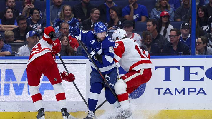 Apr 13, 2026; Tampa, Florida, USA; Tampa Bay Lightning right wing Nikita Kucherov (86) and Detroit Red Wings center Andrew Copp (18) battle for the puck in the third period  at Benchmark International Arena. Mandatory Credit: Nathan Ray Seebeck-Imagn Images