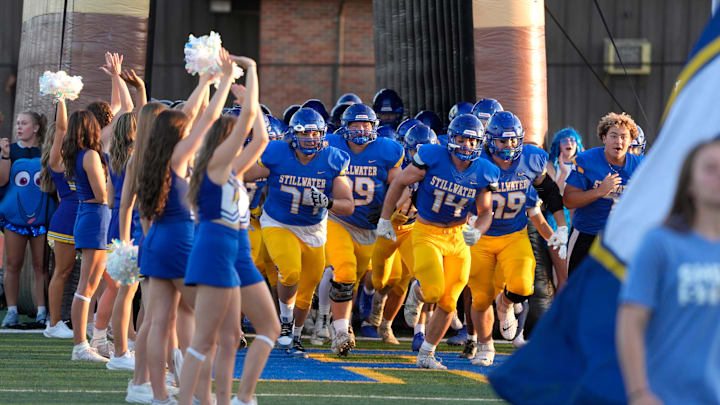Stillwater takes the field before a high school football game between Stillwater and Carl Albert in Stillwater, Okla.