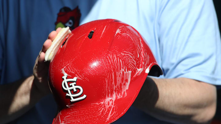 Apr 9, 2025; Pittsburgh, Pennsylvania, USA; The St. Louis Cardinals equipment manger scrubs the team batting helmets before the game against the Pittsburgh Pirates at PNC Park. Mandatory Credit: Charles LeClaire-Imagn Images Apr 9, 2025; Pittsburgh, Pennsylvania, USA; The St. Louis Cardinals equipment manger scrubs the team batting helmets before the game against the Pittsburgh Pirates at PNC Park. Mandatory Credit: Charles LeClaire-Imagn Images