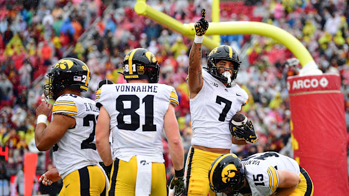 Nov 15, 2025; Los Angeles, California, USA; Iowa Hawkeyes wide receiver Dayton Howard (7) celebrates his touchdown scored against the Southern California Trojans during the first half at the Los Angeles Memorial Coliseum. Mandatory Credit: Gary A. Vasquez-Imagn Images