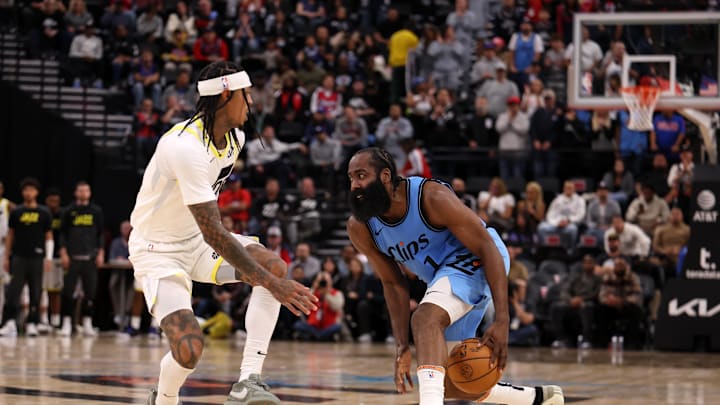 Nov 17, 2024; Inglewood, California, USA; Los Angeles Clippers guard James Harden (1) dribbles the ball against Utah Jazz guard Jordan Clarkson (00) during the fourth quarter at Intuit Dome. Mandatory Credit: Kiyoshi Mio-Imagn Images Nov 17, 2024; Inglewood, California, USA; Los Angeles Clippers guard James Harden (1) dribbles the ball against Utah Jazz guard Jordan Clarkson (00) during the fourth quarter at Intuit Dome. Mandatory Credit: Kiyoshi Mio-Imagn Images
