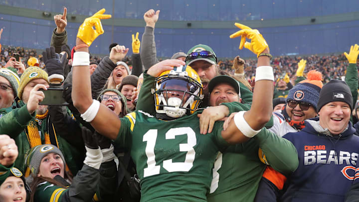 Green Bay Packers wide receiver Dontayvion Wicks (13) celebrates after catching a touchdown pass against the Bears last season.