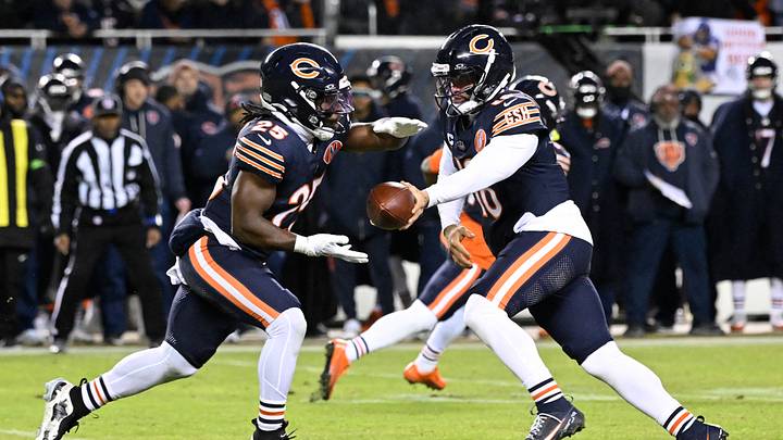 Chicago Bears quarterback Caleb Williams (18) hands off to running back Kyle Monangai (25) against the Green Bay Packers during the first half of an NFC Wild Card Round game at Soldier Field. Mandatory Credit: Matt Marton-Imagn Images