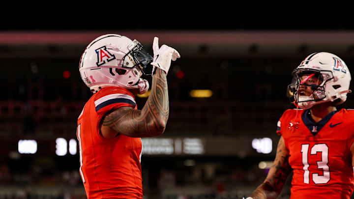 Oct 26, 2024; Tucson, Arizona, USA; Arizona Wildcats wide receiver Tetairoa McMillan (4) celebrates touchdown during the fourth quarter against the West Virginia Mountaineers at Arizona Stadium. Mandatory Credit: Aryanna Frank-Imagn Images