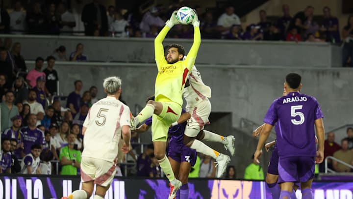 Mar 22, 2025; Orlando, Florida, USA; Orlando City goalkeeper Javier Otero (12) controls the ball against D.C. United in the second half at Inter&;Co Stadium. Mandatory Credit: Nathan Ray Seebeck-Imagn Images