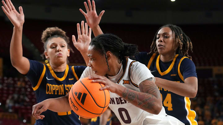 ASU Sun Devils guard Gabby Elliott (0) drives past Coppin State Bald Eagles forward Sydney Burris (21) and guard Khila Morris (24) at Desert Financial Arena on Nov. 3, 2025.