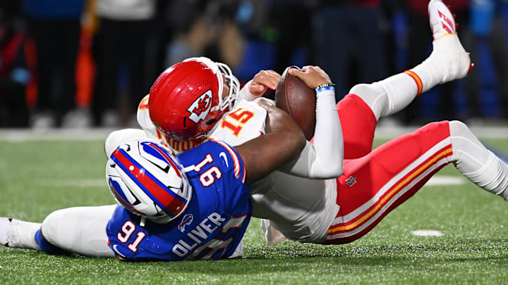 Nov 17, 2024; Orchard Park, New York, USA; Kansas City Chiefs quarterback Patrick Mahomes (15) is sacked by Buffalo Bills defensive tackle Ed Oliver (91) in the second quarter at Highmark Stadium. Mandatory Credit: Mark Konezny-Imagn Images