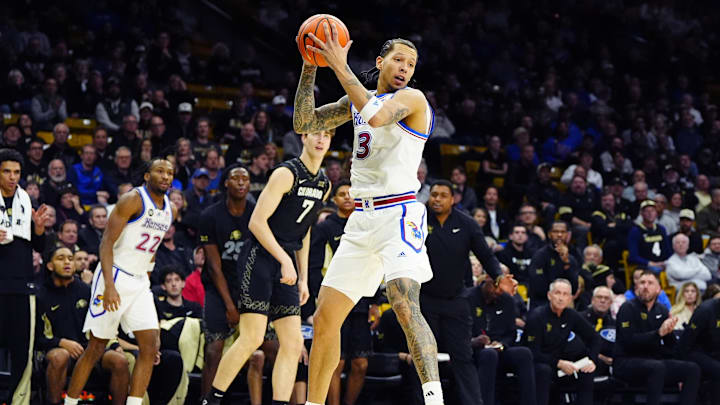 Jan 20, 2026; Boulder, Colorado, USA; Kansas Jayhawks guard Tre White (3) brings in a rebound in the second half against the Colorado Buffaloes at the CU Events Center. Mandatory Credit: Ron Chenoy-Imagn Images Jan 20, 2026; Boulder, Colorado, USA; Kansas Jayhawks guard Tre White (3) brings in a rebound in the second half against the Colorado Buffaloes at the CU Events Center. Mandatory Credit: Ron Chenoy-Imagn Images