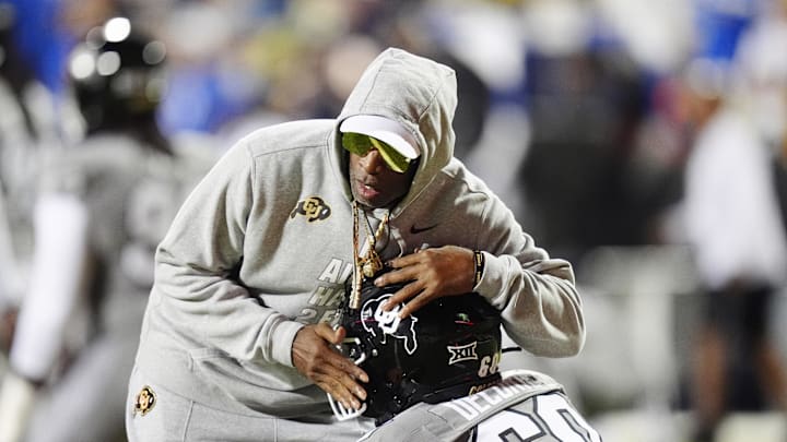 Sep 27, 2025; Boulder, Colorado, USA; Colorado Buffaloes head coach Deion Sanders greets long snapper Aiden DeCorte (60) before the game against the Brigham Young Cougars at Folsom Field. Mandatory Credit: Ron Chenoy-Imagn Images