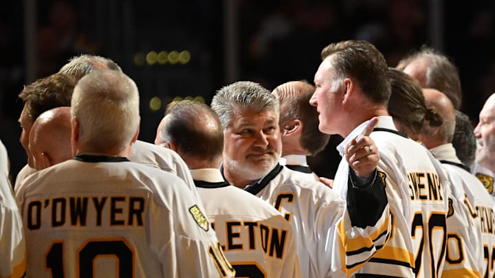 Jan 20, 2024; Boston, Massachusetts, USA; Former Boston Bruins Ray Bourque points to crowd during a ceremony before a game against the Montreal Canadiens at the TD Garden. Mandatory Credit: Brian Fluharty-Imagn Images