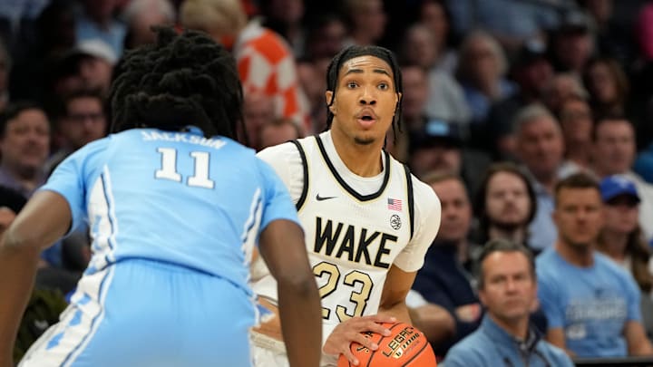 Mar 13, 2025; Charlotte, NC, USA; Wake Forest Demon Deacons guard Hunter Sallis (23) with a ball as North Carolina Tar Heels guard Ian Jackson (11) defends in the first half at Spectrum Center. Mandatory Credit: Bob Donnan-Imagn Images Mar 13, 2025; Charlotte, NC, USA; Wake Forest Demon Deacons guard Hunter Sallis (23) with a ball as North Carolina Tar Heels guard Ian Jackson (11) defends in the first half at Spectrum Center. Mandatory Credit: Bob Donnan-Imagn Images