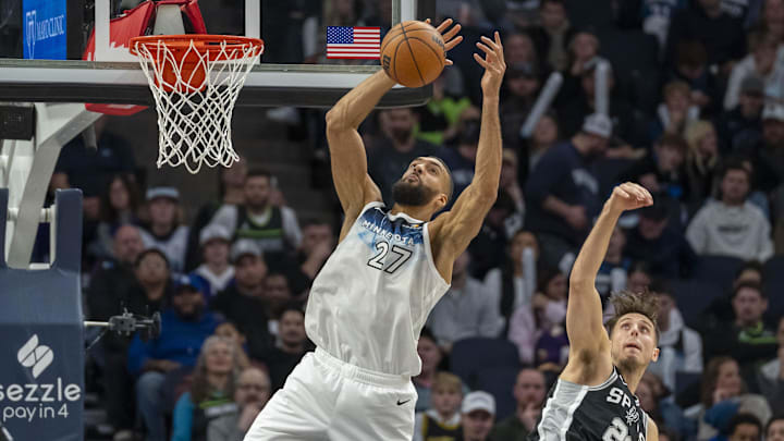 Dec 29, 2024; Minneapolis, Minnesota, USA; Minnesota Timberwolves center Rudy Gobert (27) and San Antonio Spurs forward Zach Collins (23) jump for a rebound in the second half at Target Center. Mandatory Credit: Jesse Johnson-Imagn Images Dec 29, 2024; Minneapolis, Minnesota, USA; Minnesota Timberwolves center Rudy Gobert (27) and San Antonio Spurs forward Zach Collins (23) jump for a rebound in the second half at Target Center. Mandatory Credit: Jesse Johnson-Imagn Images