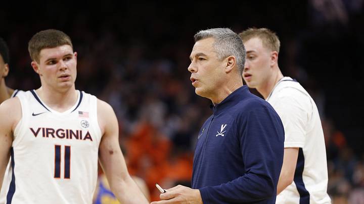 Feb 13, 2024; Charlottesville, Virginia, USA; Virginia Cavaliers head coach Tony Bennett (center) huddles with players during a stoppage in play in the first half against the Pittsburgh Panthers at John Paul Jones Arena. Mandatory Credit: Amber Searls-Imagn Images Feb 13, 2024; Charlottesville, Virginia, USA; Virginia Cavaliers head coach Tony Bennett (center) huddles with players during a stoppage in play in the first half against the Pittsburgh Panthers at John Paul Jones Arena. Mandatory Credit: Amber Searls-Imagn Images