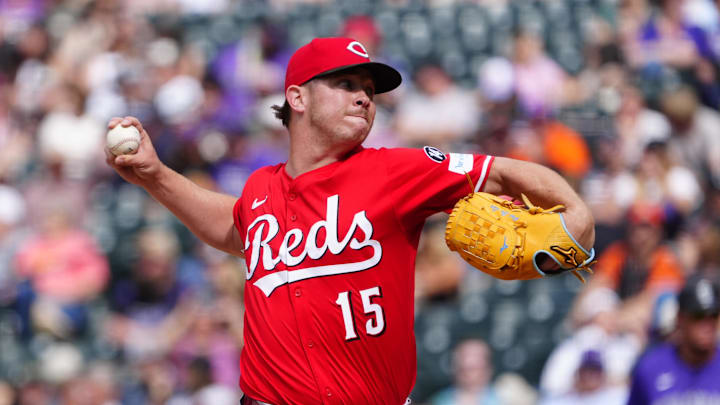 Apr 26, 2025; Denver, Colorado, USA; Cincinnati Reds relief pitcher Emilio Pagan (15) delivers a pitch in the ninth inning against the Colorado Rockies at Coors Field. Mandatory Credit: Ron Chenoy-Imagn Images