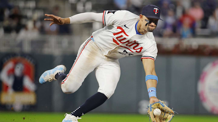 Sep 24, 2024; Minneapolis, Minnesota, USA; Minnesota Twins third baseman Royce Lewis (23) fields a ball hit by Miami Marlins third baseman Connor Norby (not pictured) in the ninth inning at Target Field. Mandatory Credit: Bruce Kluckhohn-Imagn Images