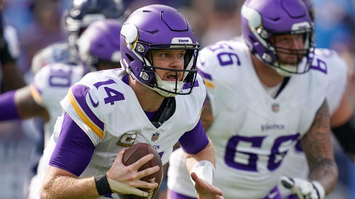 Minnesota Vikings quarterback Sam Darnold (14) runs into position to pass during the first quarter against the Tennessee Titans at Nissan Stadium in Nashville, Tenn., Sunday, Nov. 17, 2024. Minnesota Vikings quarterback Sam Darnold (14) runs into position to pass during the first quarter against the Tennessee Titans at Nissan Stadium in Nashville, Tenn., Sunday, Nov. 17, 2024.
