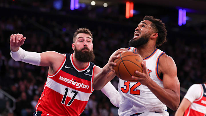 Oct 9, 2024; New York, New York, USA; New York Knicks center Karl-Anthony Towns (32) drives to the basket against Washington Wizards center Jonas Valanciunas (17) during the second half at Madison Square Garden. Mandatory Credit: Vincent Carchietta-Imagn Images Oct 9, 2024; New York, New York, USA; New York Knicks center Karl-Anthony Towns (32) drives to the basket against Washington Wizards center Jonas Valanciunas (17) during the second half at Madison Square Garden. Mandatory Credit: Vincent Carchietta-Imagn Images