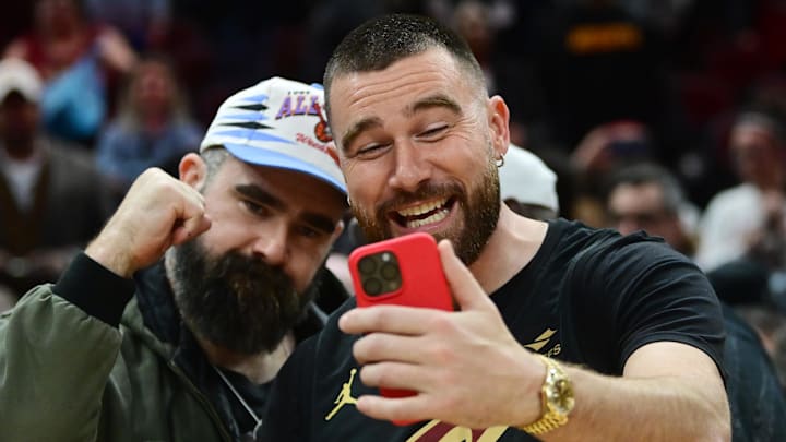 Mar 5, 2024; Cleveland, Ohio, USA; Cleveland natives and NFL players Travis, right, and Jason Kelce celebrate after the Cleveland Cavaliers beat the Boston Celtics during the second half at Rocket Mortgage FieldHouse. Mandatory Credit: Ken Blaze-Imagn Images