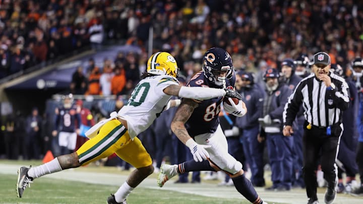 Dec 20, 2025; Chicago, Illinois, USA; Chicago Bears tight end Colston Loveland (84) runs after the catch against Green Bay Packers safety Javon Bullard (20) during overtime at Soldier Field. Mandatory Credit: Mike Dinovo-Imagn Images