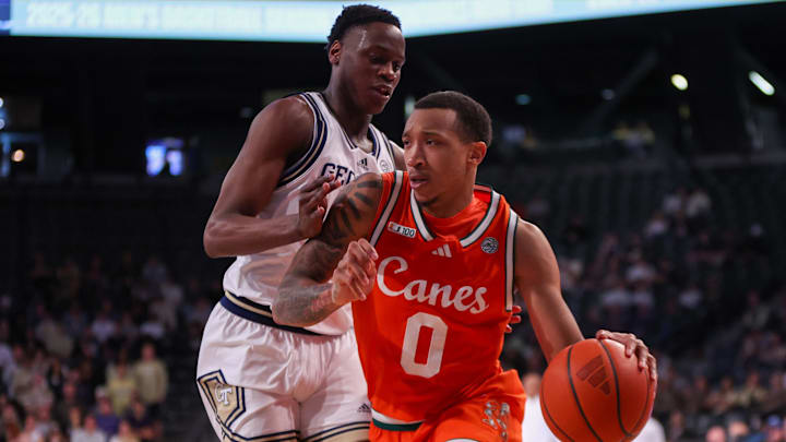 Mar 4, 2025; Atlanta, Georgia, USA; Miami Hurricanes guard Matthew Cleveland (0) is defended by Georgia Tech Yellow Jackets forward Darrion Sutton (10) in the first half at McCamish Pavilion. Mandatory Credit: Brett Davis-Imagn Images Mar 4, 2025; Atlanta, Georgia, USA; Miami Hurricanes guard Matthew Cleveland (0) is defended by Georgia Tech Yellow Jackets forward Darrion Sutton (10) in the first half at McCamish Pavilion. Mandatory Credit: Brett Davis-Imagn Images