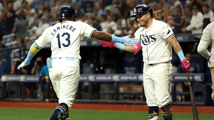 Tampa Bay Rays third baseman Junior Caminero (13) is congratulated by first base Jonathan Aranda after hitting a home run. Tampa Bay Rays third baseman Junior Caminero (13) is congratulated by first base Jonathan Aranda after hitting a home run.