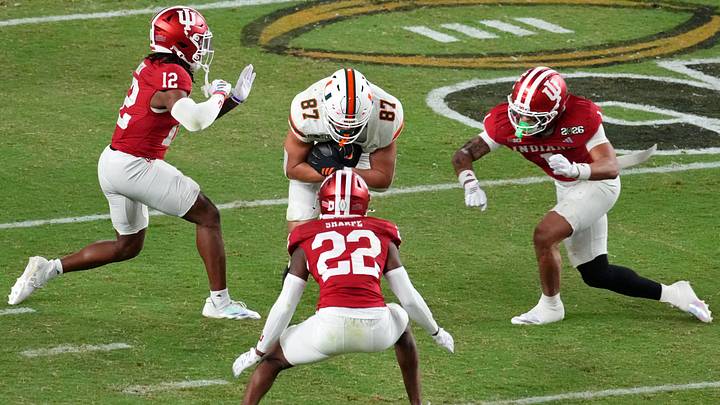 Jan 19, 2026; Miami Gardens, FL, USA; Miami Hurricanes tight end Alex Bauman (87) runs with the ball against the Indiana Hoosiers during the second half of the College Football Playoff National Championship game at Hard Rock Stadium. Mandatory Credit: James Lang-Imagn Images Jan 19, 2026; Miami Gardens, FL, USA; Miami Hurricanes tight end Alex Bauman (87) runs with the ball against the Indiana Hoosiers during the second half of the College Football Playoff National Championship game at Hard Rock Stadium. Mandatory Credit: James Lang-Imagn Images
