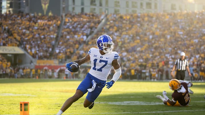 Nov 23, 2024; Tempe, Arizona, USA; Brigham Young Cougars wide receiver Keelan Marion (17) scores a touchdown against the Arizona State Sun Devils at Mountain America Stadium. Mandatory Credit: Mark J. Rebilas-Imagn Images