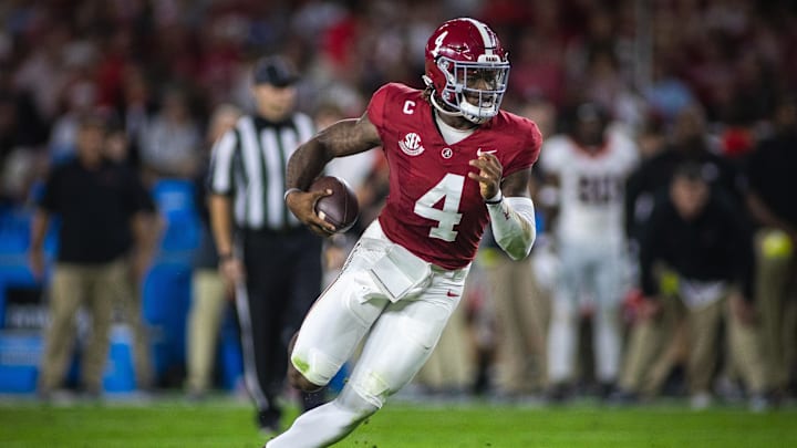 Sep 28, 2024; Tuscaloosa, Alabama, USA;  Alabama Crimson Tide quarterback Jalen Milroe (4) runs against the Georgia Bulldogs during the first quarter at Bryant-Denny Stadium. Mandatory Credit: Will McLelland-Imagn Images
