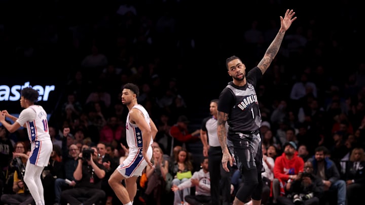 Feb 12, 2025; Brooklyn, New York, USA; Brooklyn Nets guard D'Angelo Russell (1) celebrates his three point shot against the Philadelphia 76ers during the third quarter at Barclays Center. Mandatory Credit: Brad Penner-Imagn Images