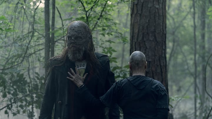 Alpha places her hand on Beta's chest in a sign of affection