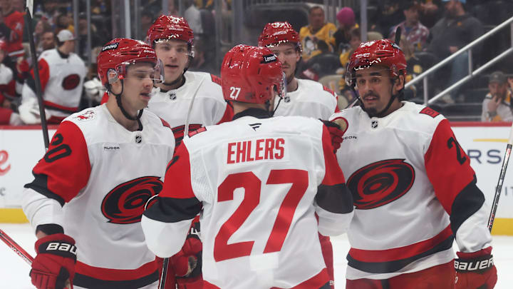 Mar 22, 2026; Pittsburgh, Pennsylvania, USA;  Carolina Hurricanes left wing Nikolaj Ehlers (27) congratulates Carolina Hurricanes center Seth Jarvis (right) on his goal during the second period against the Pittsburgh Penguins at PPG Paints Arena. Mandatory Credit: Charles LeClaire-Imagn Images