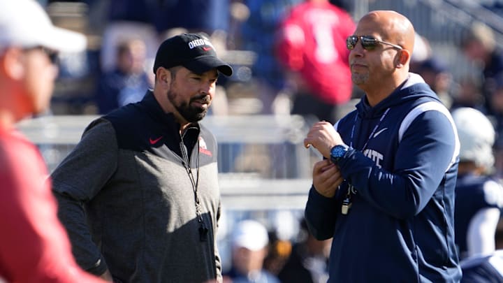 Oct 29, 2022; University Park, Pennsylvania, USA; Ohio State Buckeyes head coach Ryan Day talks to Penn State Nittany Lions head coach James Franklin before the game at Beaver Stadium.