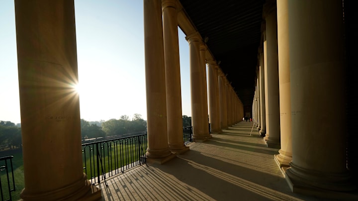 The sun shines through the colonnades at Gies Memorial Stadium in Champaign prior to the NCAA football game between the Illinois Fighting Illini and the Ohio State Buckeyes on Oct. 11, 2025.