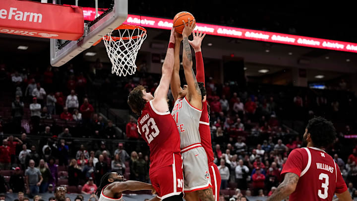Nebraska Cornhuskers forward Andrew Morgan (23) fould Ohio State Buckeyes forward Devin Royal (21) during the first overtime of the NCAA men's basketball game at Value City Arena in Columbus on March 4, 2025. Ohio State won 116-114 in double overtime.
