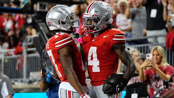 Ohio State Buckeyes wide receiver Carnell Tate (17) celebrates a touchdown by wide receiver Jeremiah Smith (4) during the first half of the NCAA football game against the Minnesota Golden Gophers at Ohio Stadium in Columbus on Oct. 4, 2025.