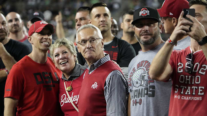 Sep 3, 2022; Columbus, Ohio, USA;  Jim Tressel and Ellen Tressel are recognized with players from